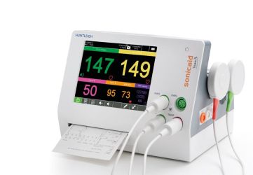 The Huntleigh Soncaid Team3 Series Fetal/Maternal Monitor with fetal parameters active on the screen, a printout and transducers attached on the front and side of the monitor.